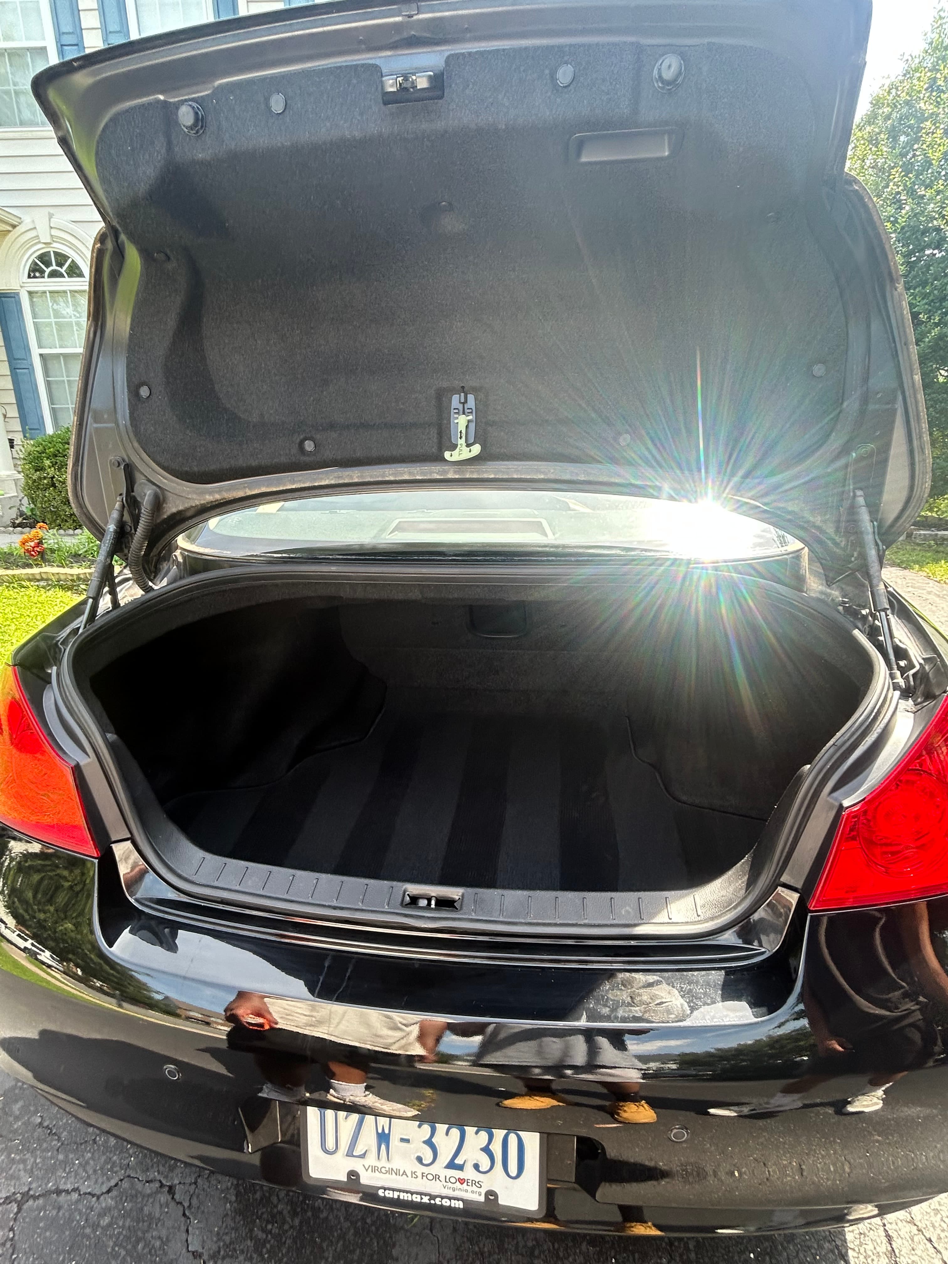 Clean black sedan trunk after detailing by AJ Car Detailing
